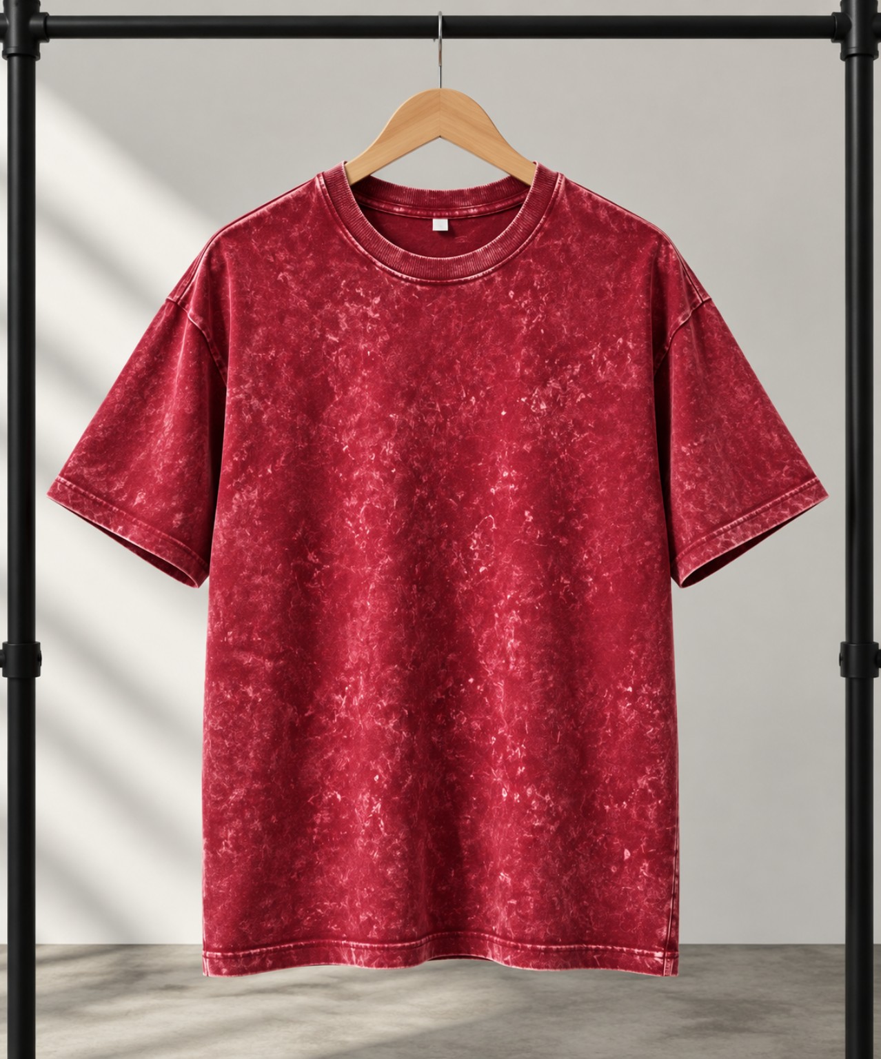 Dark Berry acid-wash oversized t-shirt on a hanger